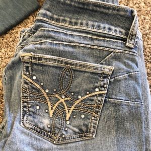 Wrangler jeans size 1/2 X 36.  Worn at bottom back see photos.